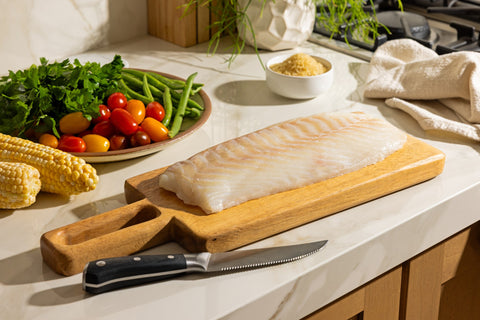 Raw Icelandic cod loin with corn, cherry tomatoes and fresh parsley