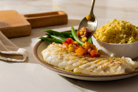 Topping pan-seared cod with charred corn and tomatoes